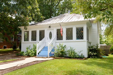 Front elevation of sleeping porch and leaded glass windows facing street.