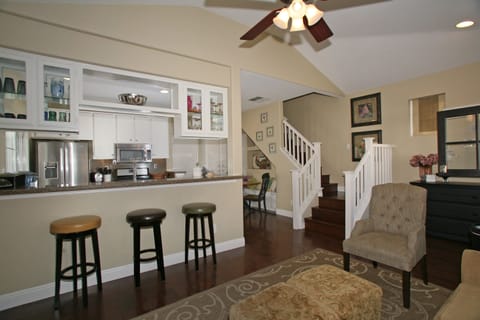 Welcome to The Cottage featuring an open floor plan with breakfast bar.