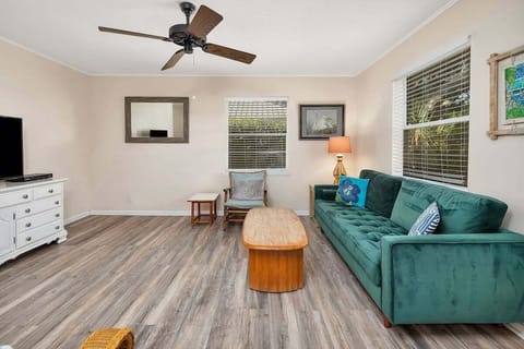 Living room with green sofa and seating