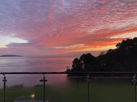 The views from the balcony really are amazing. You can enjoy sunrise and sunsets, watch the fishing boats come in and out, spot dolphins, and enjoy the twinkling lights of the bay by night.