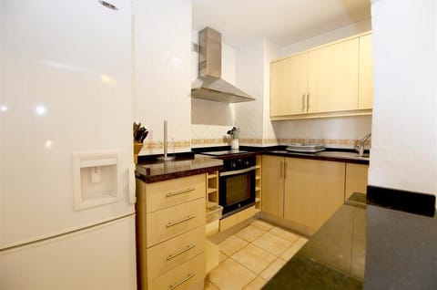 Kitchen view from the serving bar next to the dining area