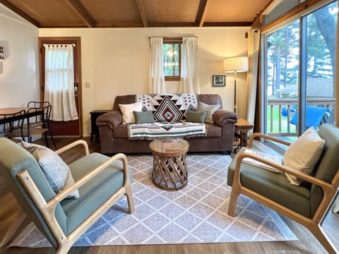 Living room area with dining table that seats 4