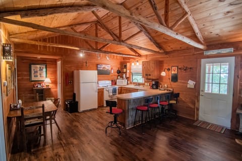 Open floor plan with bar and dining table