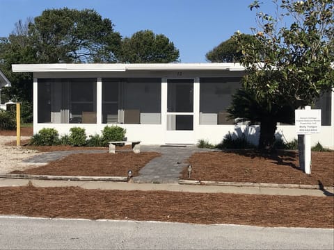 Screened porch for relaxing after a busy day in the sun.  