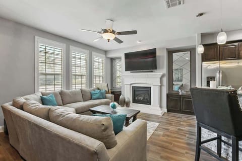 Comfortable high end living room with chefs Kitchen 