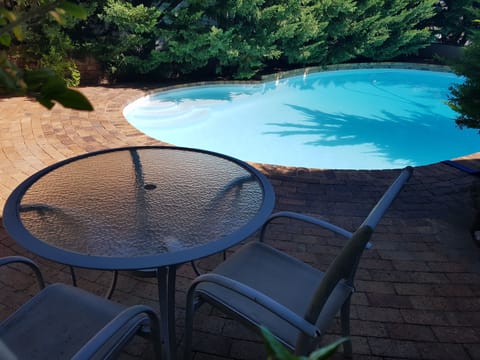 Outside table & chairs for breakfasts etc
View from the pool-facing bedsitter