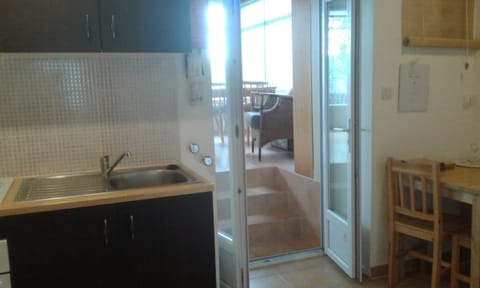 Kitchen and 3 steps leading up to the conservatory