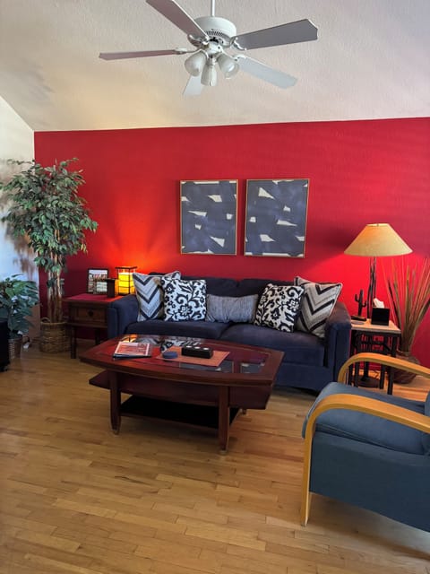 Living Room is bright & comfortable in second floor condo with vaulted ceilings.