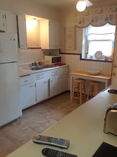 Galley kitchen with original classic fifties cabinetry