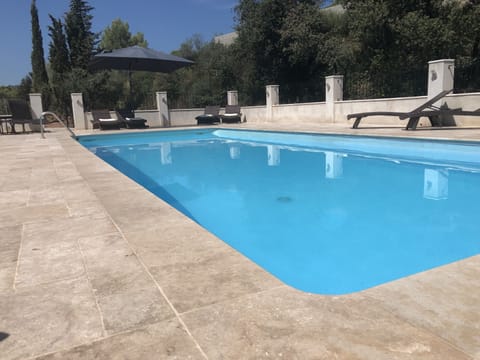New pool & terrace. Views to the west of the escarpment behind the villa 