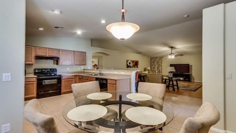 Kitchen with view towards family room.  Vaulted ceilings across both rooms.