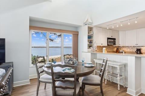 Dining Table with Water Views at 1883 Beachside Tennis