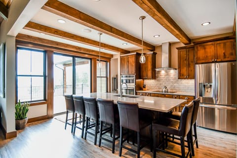 Fully stocked kitchen with island seating for 7. 