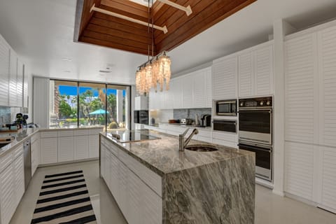 Marble counter tops with double oven, fridge, microwave and incredible views.