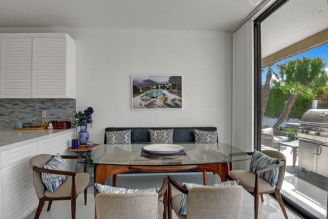 Breakfast table overlooking pool. 