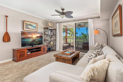 Sink into plush sofas while tropical breezes flow through your balcony doors, creating the perfect retreat for relaxation.