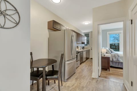 A view of the kitchen and entrance into the back bedroom.
