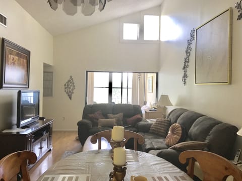 living room/ dinette area, screened/ and or enclosed furnished porch in rear 