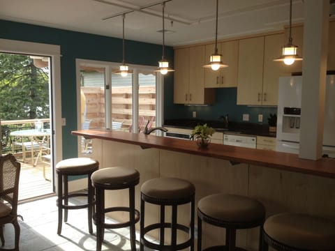 New custom kitchen with deck facing harbor