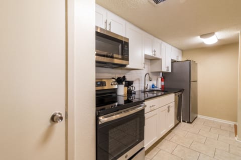 Kitchen with all appliances and supplies,