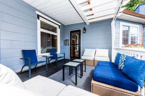 Covered outdoor lounge area adjacent to kitchen.