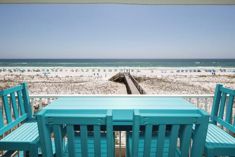 Balcony View - Wooden boardwalk pictured is the private walkway to the water and your complimentary beach service setup.