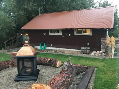 Side yard with fire pit, and Tipi