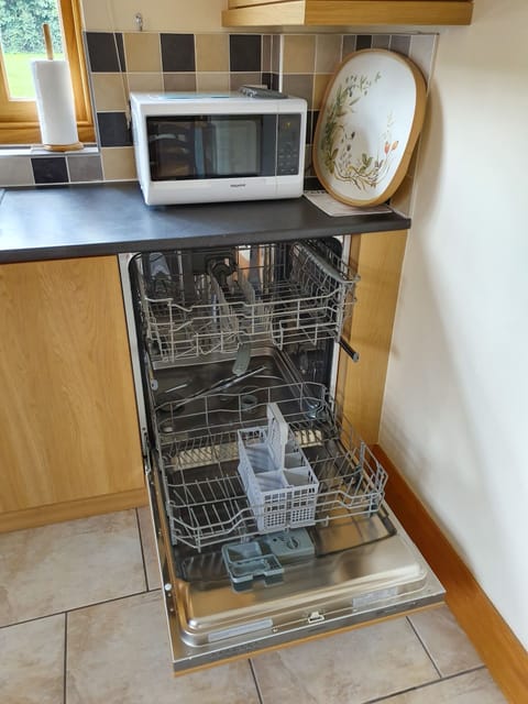 Fully fitted kitchen with oven, hob, dishwasher, fridge and freezer