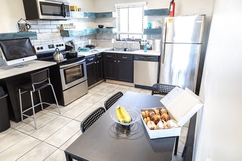 Kitchen has utensils, seasonings, water, coffee etc.