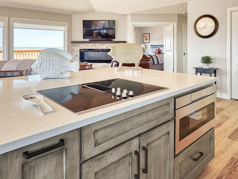 Sleek built in stove top on the kitchen island