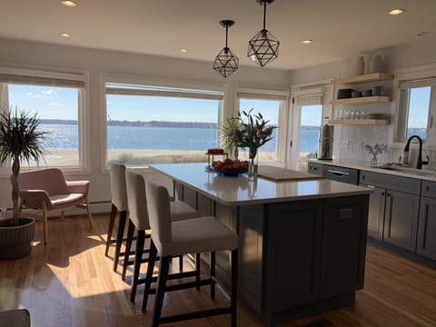 New kitchen with river view! Fully stocked, with pantry for storage.