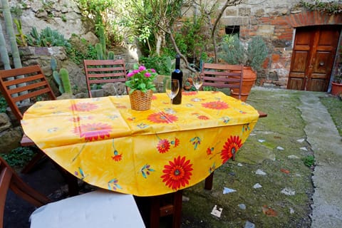 In the outdoor courtyard you can enjoy dinner with a glass of wine.