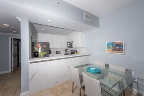 Living room has dining table seating 5-6. 