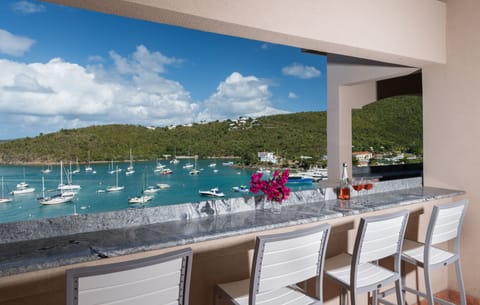 Full length new granite bar seats 4 on patio overlooking Cruz Bay and harbor.