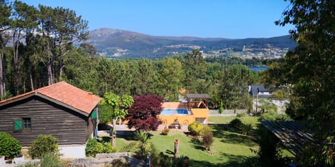 Rosal Lodge looking over the pool, towards Rio Mino and Portugal