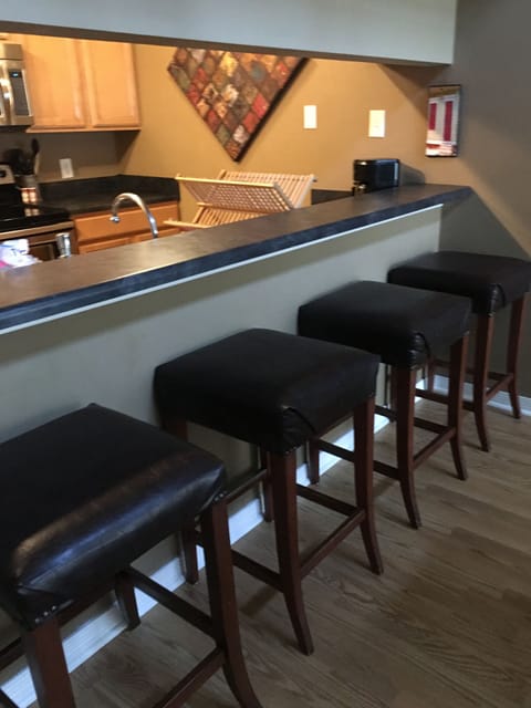Kitchen pass through to dining with barstools