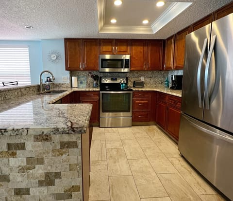Fully equipped kitchen with updated stainless steel appliances. - Fully equipped kitchen with updated stainless steel appliances. Perfect space for cooking up your favorite homecooked meals and snacks while here on vacation.
