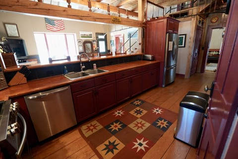 The kitchen overlooks the living area so everyone can be part of the action!