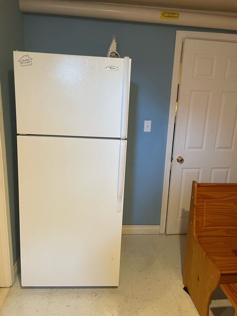 full refrigerator and door for privacy from living room