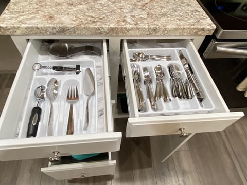 Silverware and dishes that include Serving for 12+