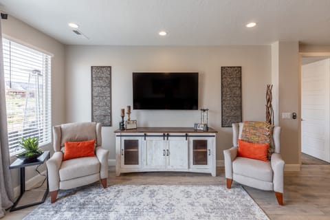 Downstairs Living Room Entertainment Center - The Living Room is located adjacent to the dining room and is the perfect place to relax and watch your favorite movie or TV program.