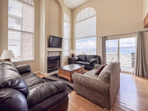Bright, cozy living room with fireplace and plush seating—perfect for relaxing or movie nights together.