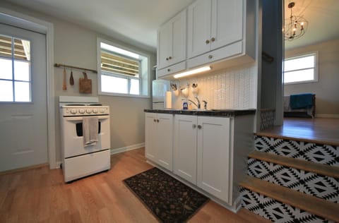 plates, bowls, cups, mugs, utensils and pots and pans on hand for guests