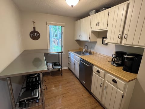 Butlers pantry includes dishwasher, second sink, and additional small appliances