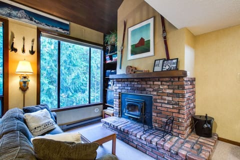 Living room with cozy wood burning fireplace