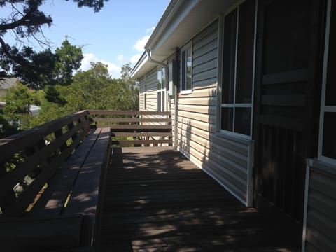 Open air shaded side deck. Another outdoor space to gather and visit.