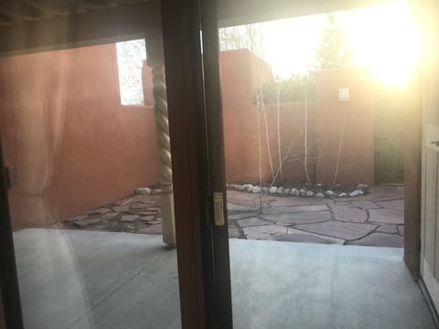 Private patio with yard