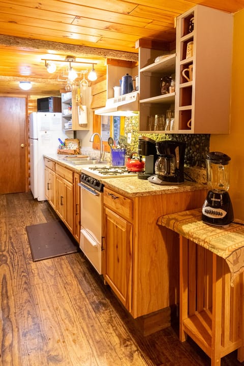 Kitchen includes Keurig and drip coffee machines, dishes, utensils and cookware