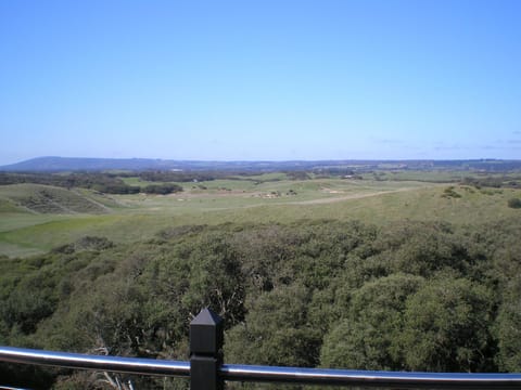 The view from the top deck over golf course and farms to Arthurs seat.