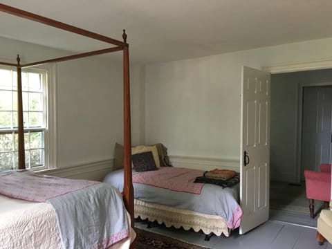 BR 2 with queen and twin, antique settee and slipper chair sitting area